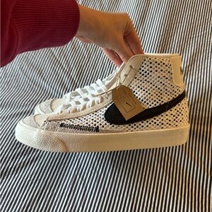 Nike Cream and Black Nike Blazers